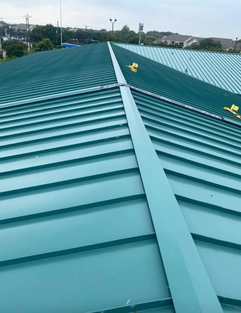 Green commercial metal roof ridge and valley for Metal Roof Repair in East Grand Rapids