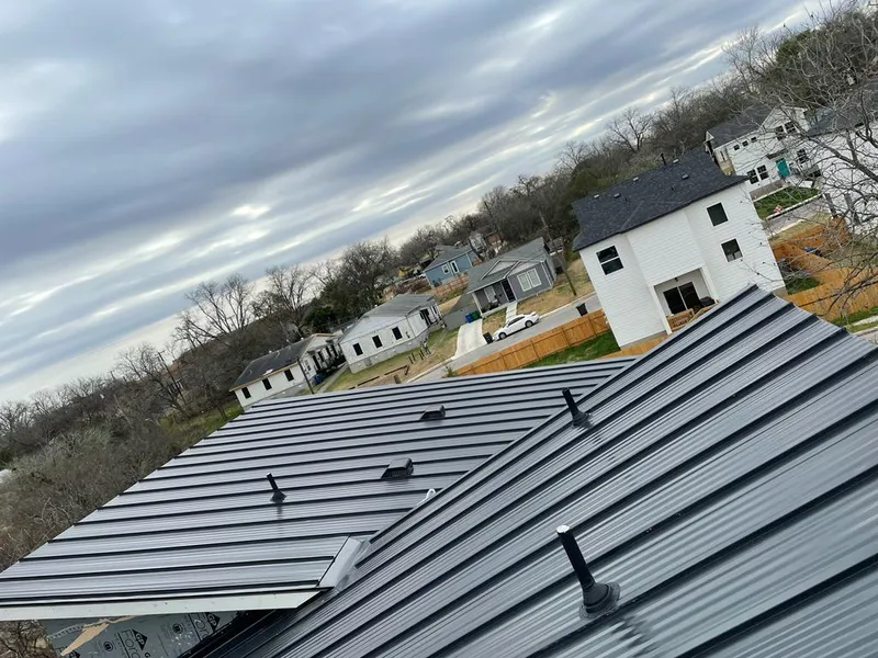 Standing seam metal roof panels with vents for Skylight Repair in East Grand Rapids